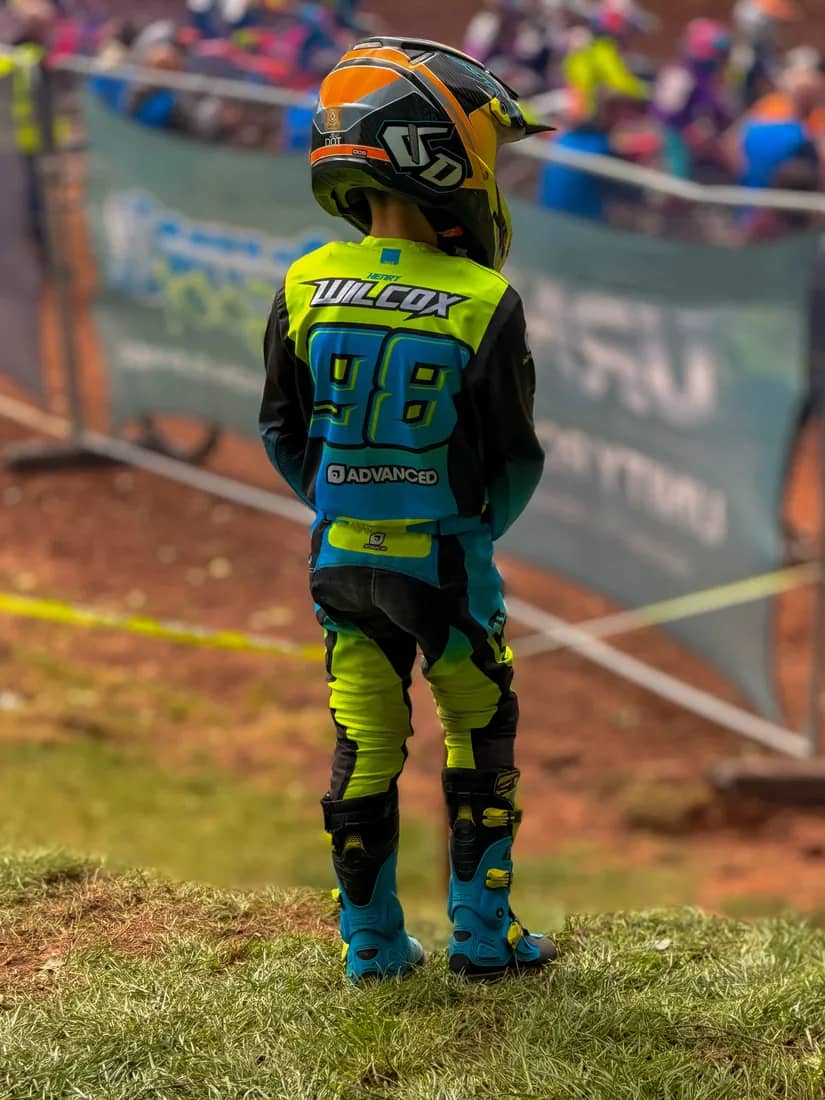 Henry Wilcox trackside in his #98 kit, watching the racing