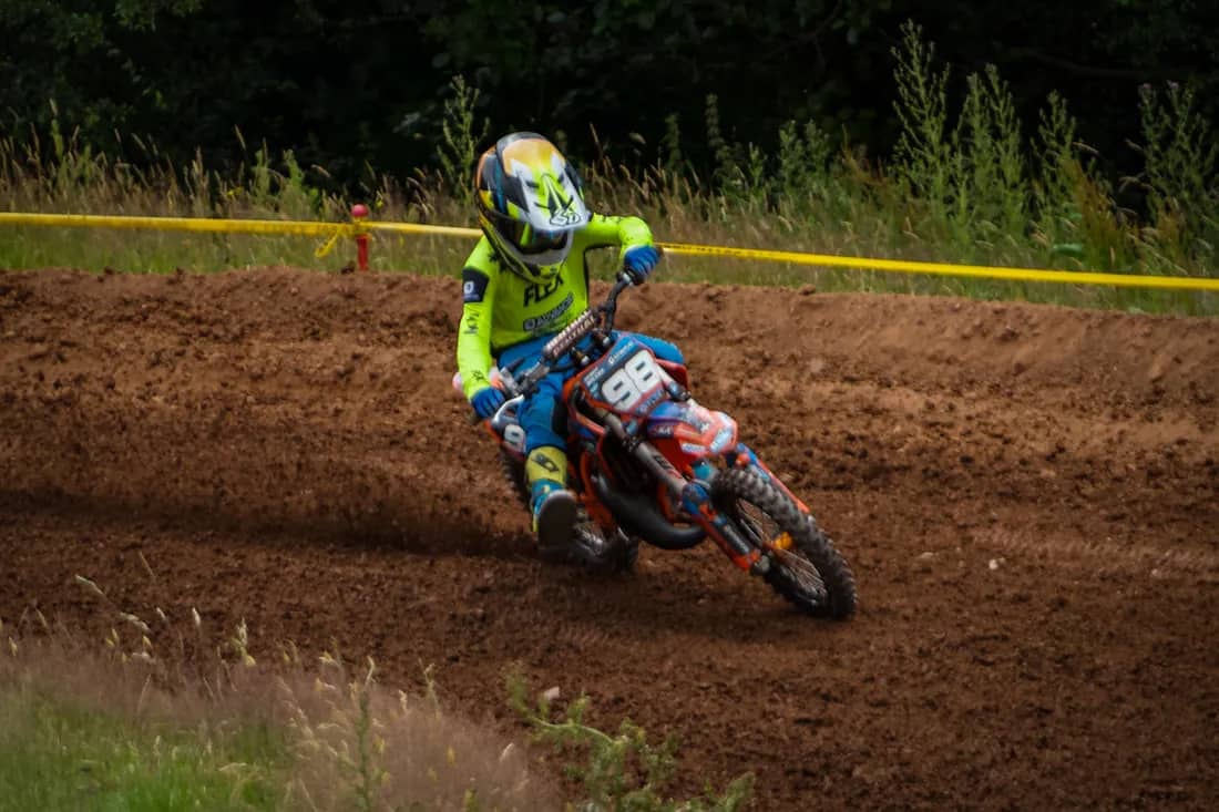 Henry Wilcox cornering his #98 KTM on a dirt track