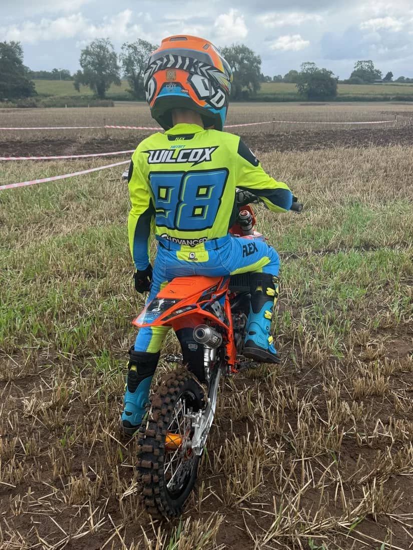 Henry Wilcox sat on his KTM between motos, WILCOX 98 on his back
